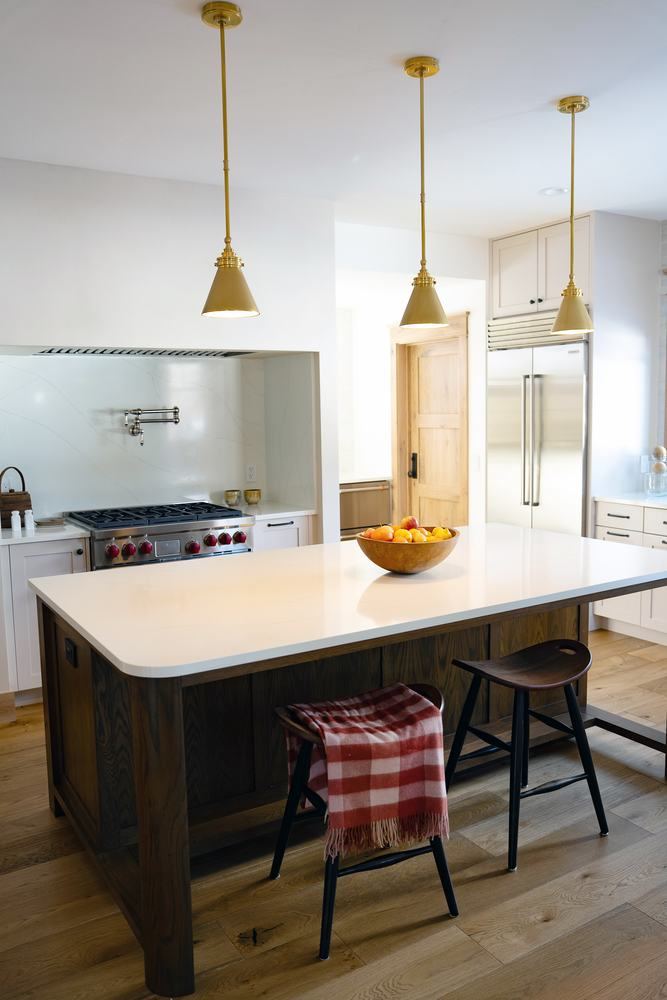 Kitchen with island and painted cabinetry