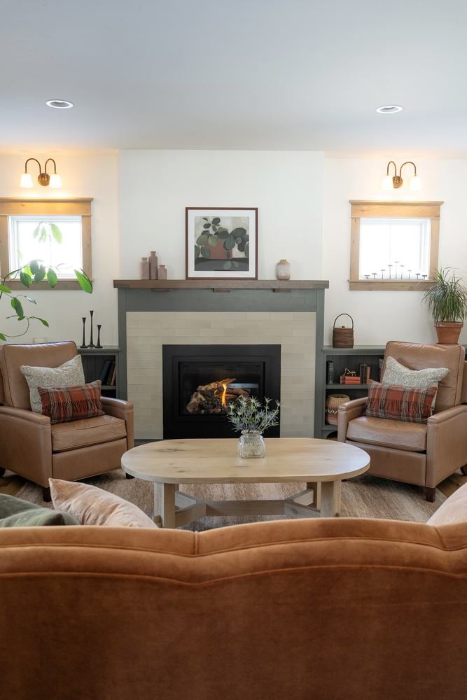 Living room with fireplace and side windows