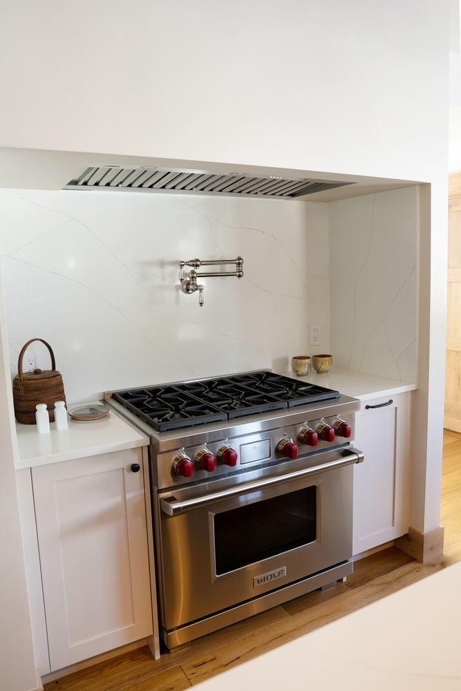 Pot filler and range in the painted kitchen