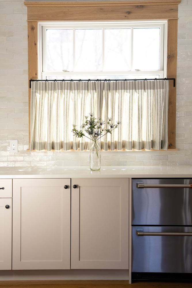 Sink window with cafe curtain, drawer dishwasher