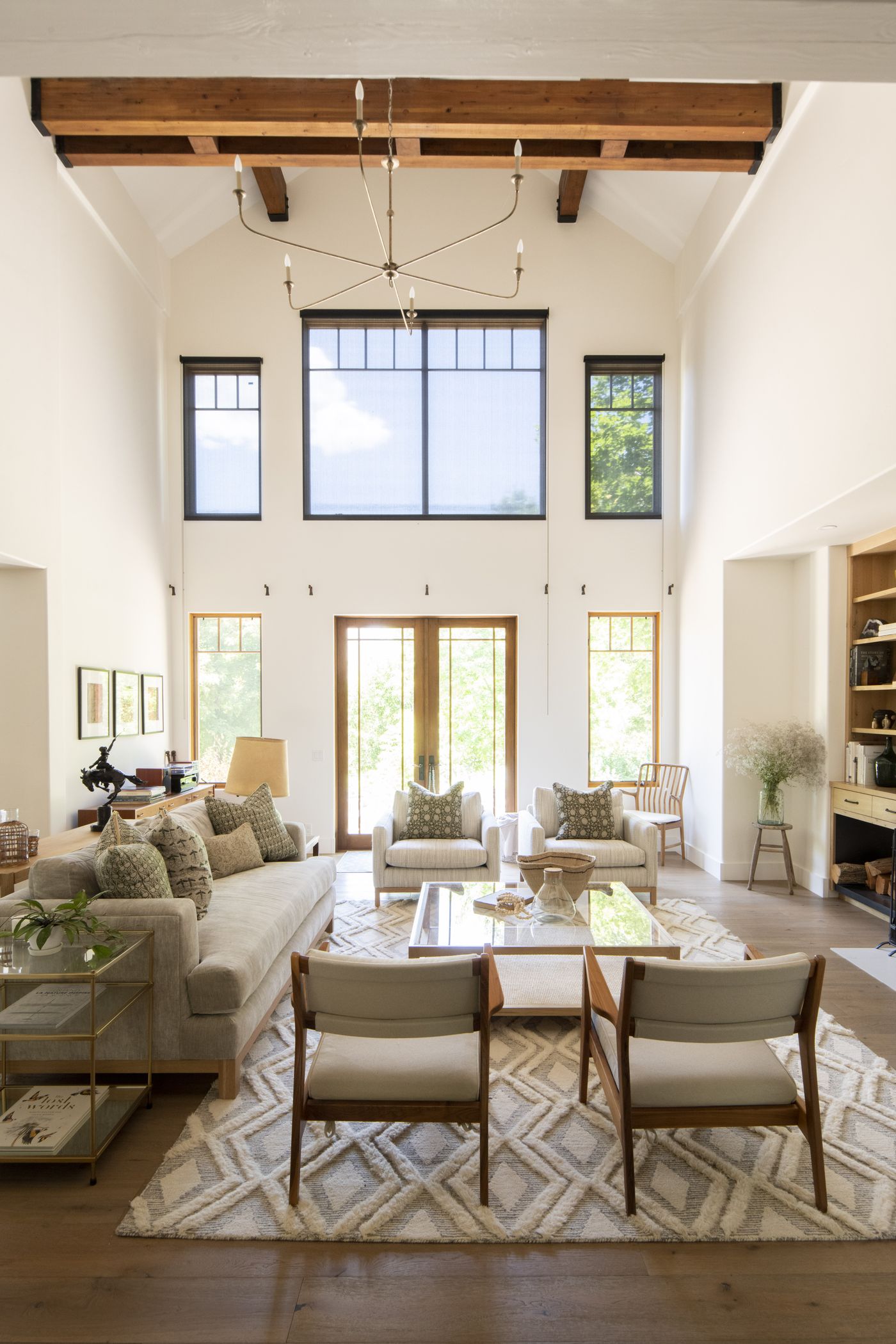 Living room with double-height windows in a Tormey-built home