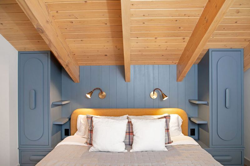 Built-in wardrobes under exposed rafters
