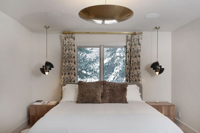 Bedroom with pendant lights and patterned drapes