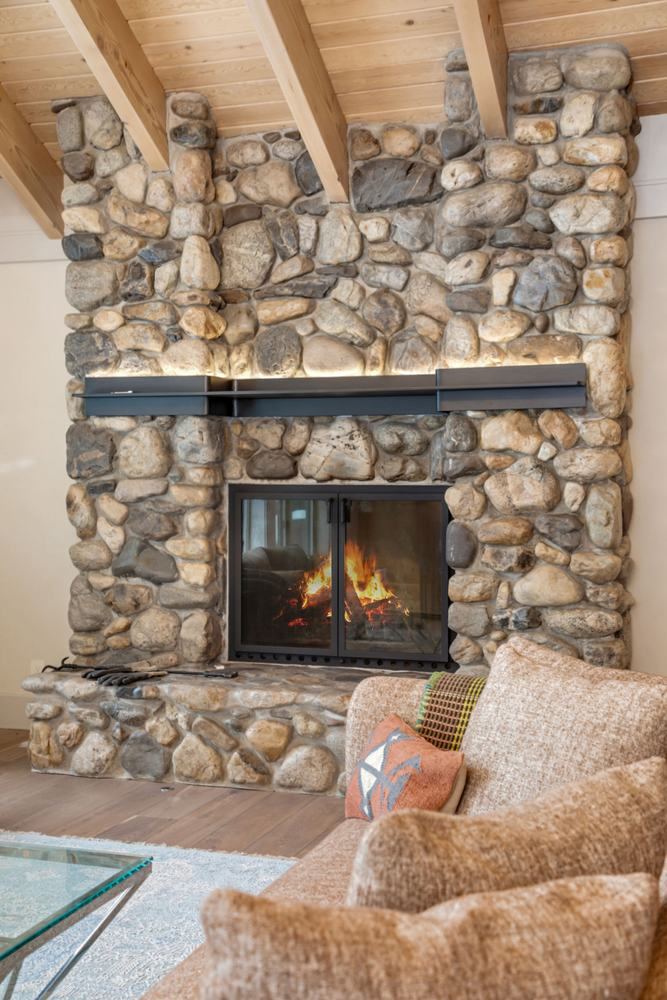 Fieldstone fireplace from the sofa