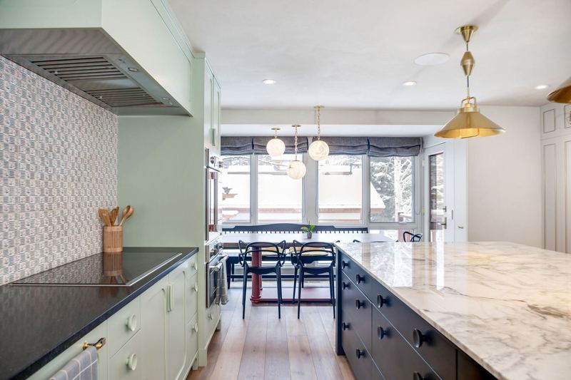 Glazed tile backsplash, open shelving in walnut