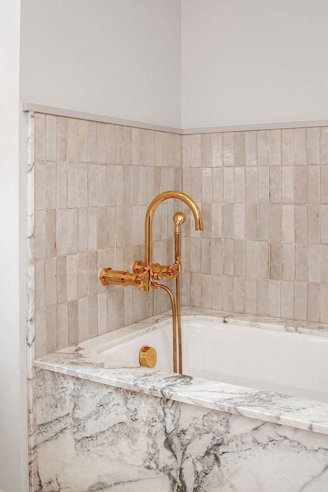 Marble tub surround, brass filler