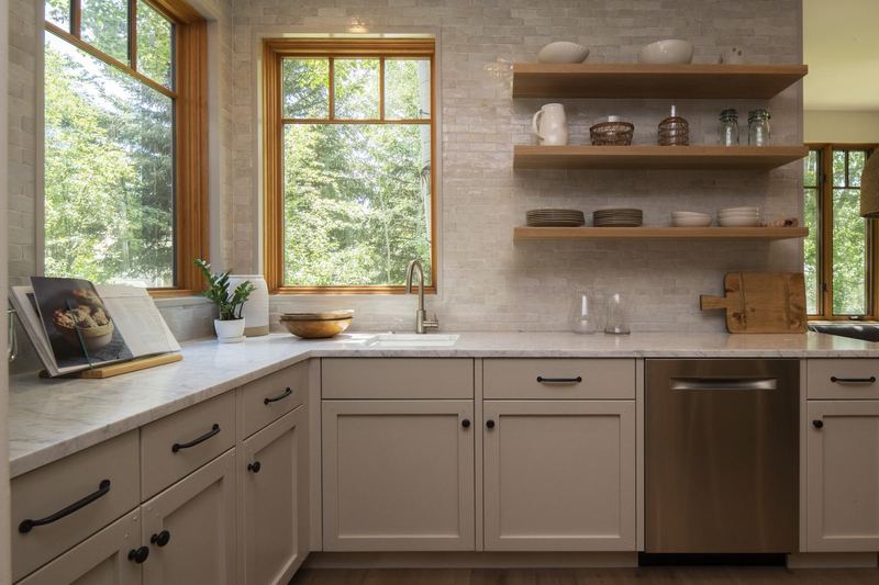 Corner windows over the sink, open oak shelves